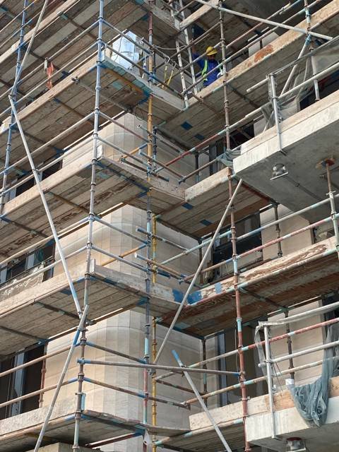 Facade works on scaffolding