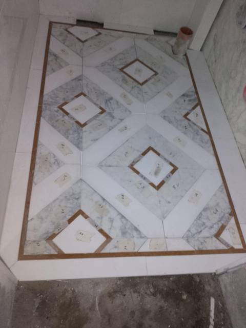 Decorative marble floor inlay