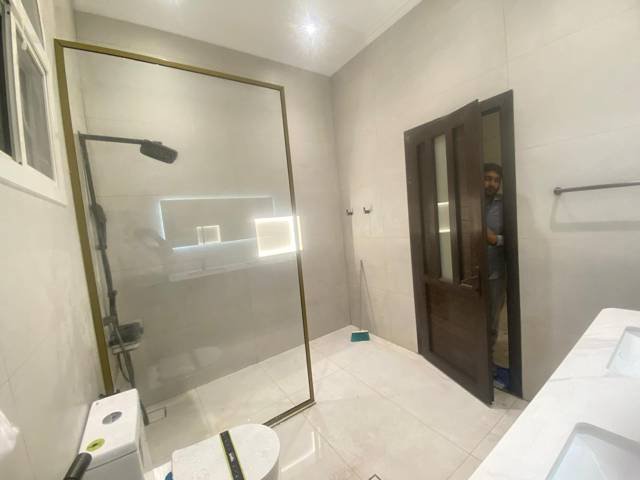 Glass shower enclosure