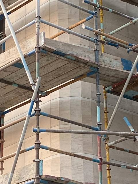 Stone cladding to a curved column