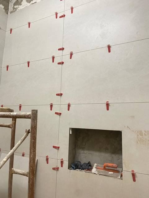 Large-format wall tiling in progress